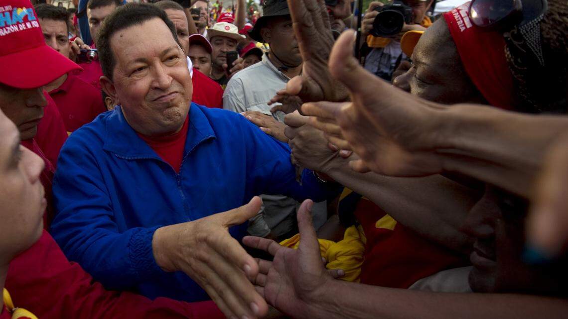 Venezuelan President Hugo Chavez greets supporters during a campaign rally in Cabimas on September 30, 2012.