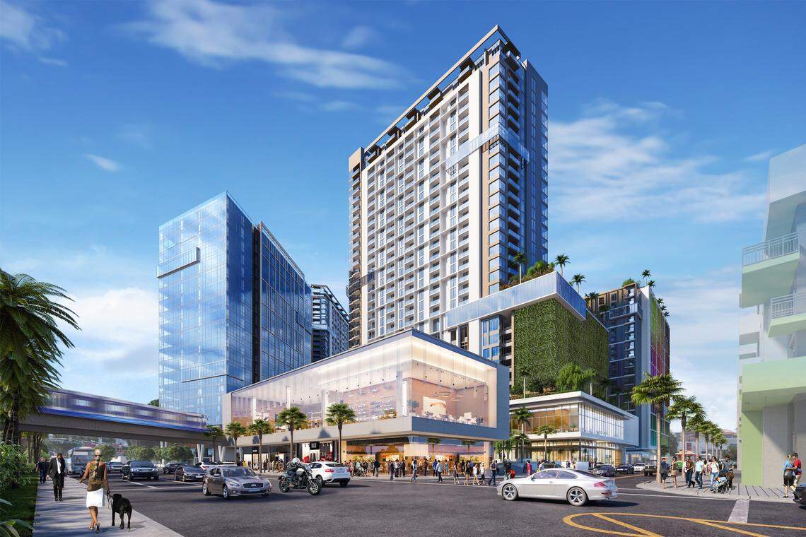 An early rendering of the expanded plan for the redevelopment of the Douglas Road Metrorail station shows a retail building in the foreground and a glass office building at the right flanking a tall residential tower in what the developers call an “urban village.” The tower has since been replaced in the plan with a taller, 40-story skyscraper.