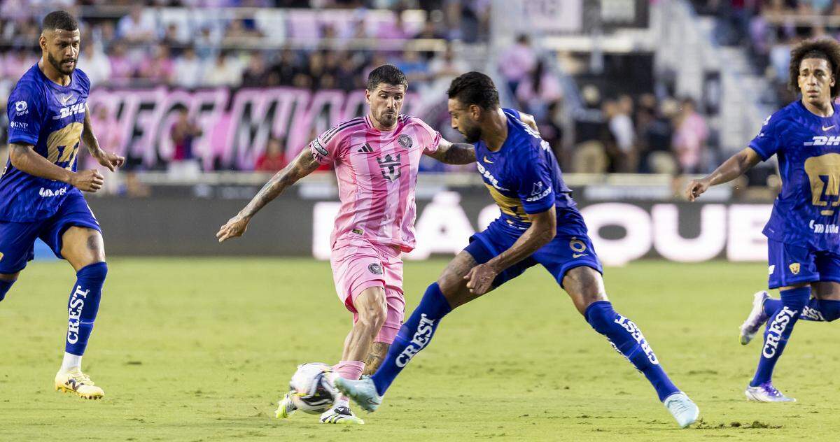 Inter Miami CF midfielder Rodrigo De Paul (7) and Pumas UNAM defender Nathan Silva (6) compete for the ball in the first half of their Leagues Cup Phase One soccer match at Chase Stadium on Wednesday, Aug. 6, 2025, in Fort Lauderdale, Fla.