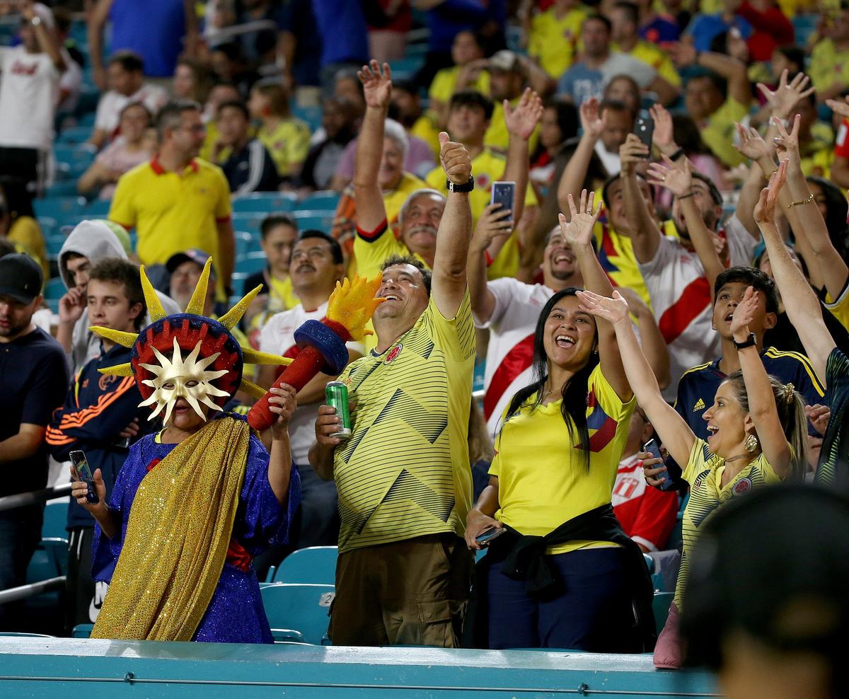 Colombian and Peruvian fans react during the first half of a friendly match between Colombia and Peru at Hard Rock Stadium in Miami Gardens on Friday, November 15, 2019. The stadium is bidding to host games for the 2026 World Cup.