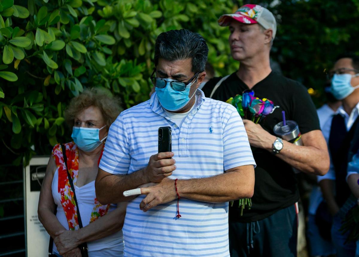 People attend a vigil for Christine Englehardt outside of the Albion Hotel in South Beach, Florida on Friday, March 26, 2021. Englehardt, 24, died at the hotel after police say two spring breakers drugged and raped her.