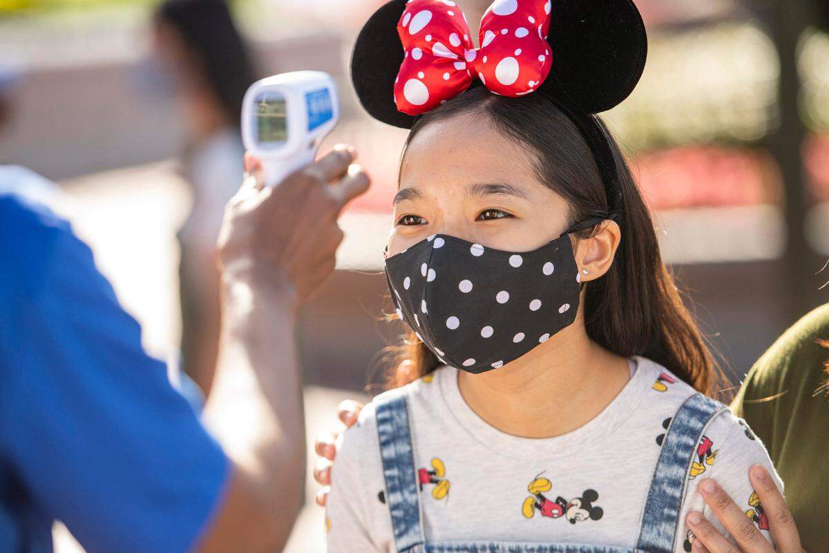 All guests will be required to undergo temperature screenings prior to entering a theme park at Walt Disney World Resort in Lake Buena Vista, Fla. Anyone displaying a temperature of 100.4 degrees Fahrenheit or higher will be directed to an additional location for rescreening and assistance; those who again measure 100.4 degrees Fahrenheit or higher will not be allowed entry, nor will those in their party. (David Roark, photographer)