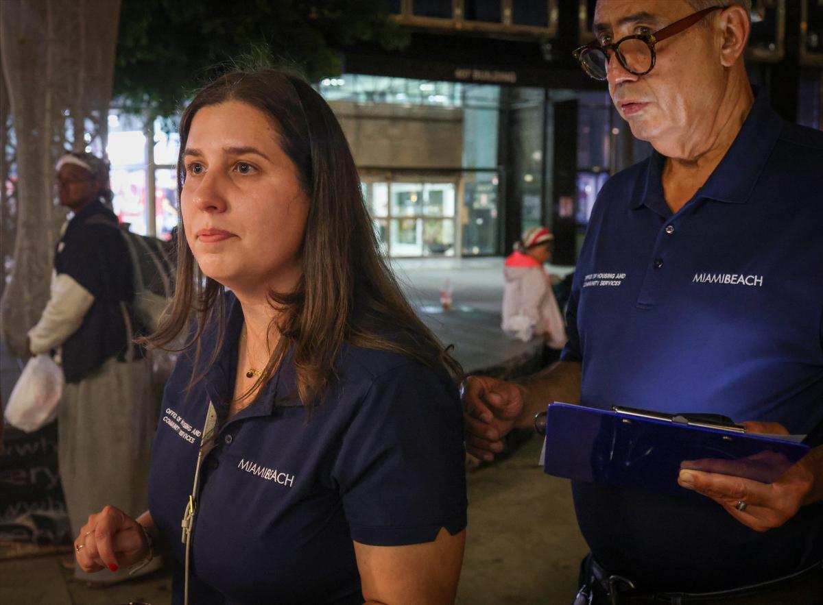 Alba Tarre, director of Miami Beach’s Office of Housing and Community Services, helps with canvassing in Lincoln Road Mall on Thursday, Aug. 22, 2024.