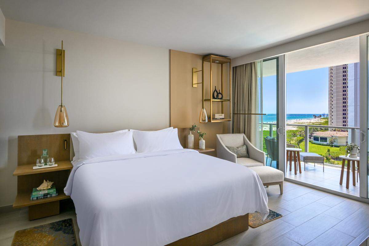 A luxurious king room with a view at Amrit Ocean Resort.