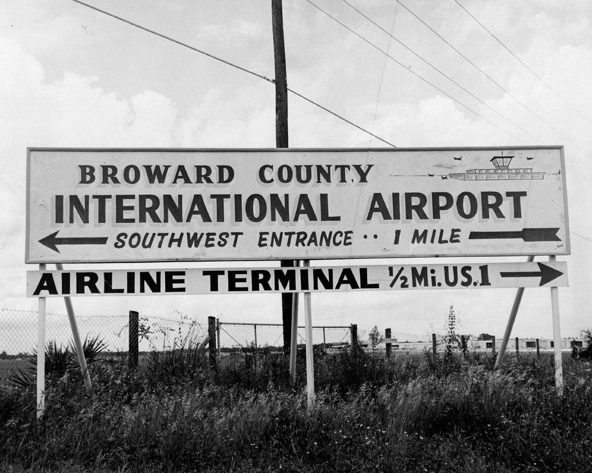 A sign points the way to the Broward airport.