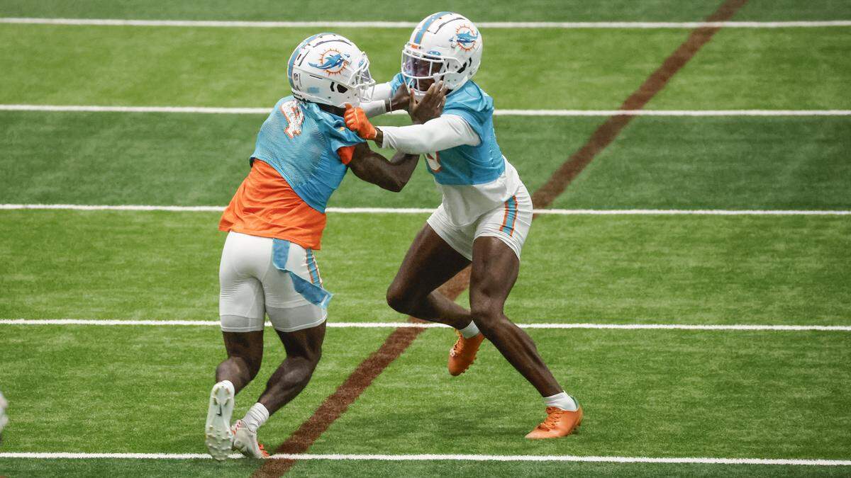 Miami Dolphins cornerbacks Kader Kohou (4) and Noah Igbinoghene (9) run through during practice at the Baptist Health Training Complex in Miami Gardens, Florida on Friday, July 28, 2023.