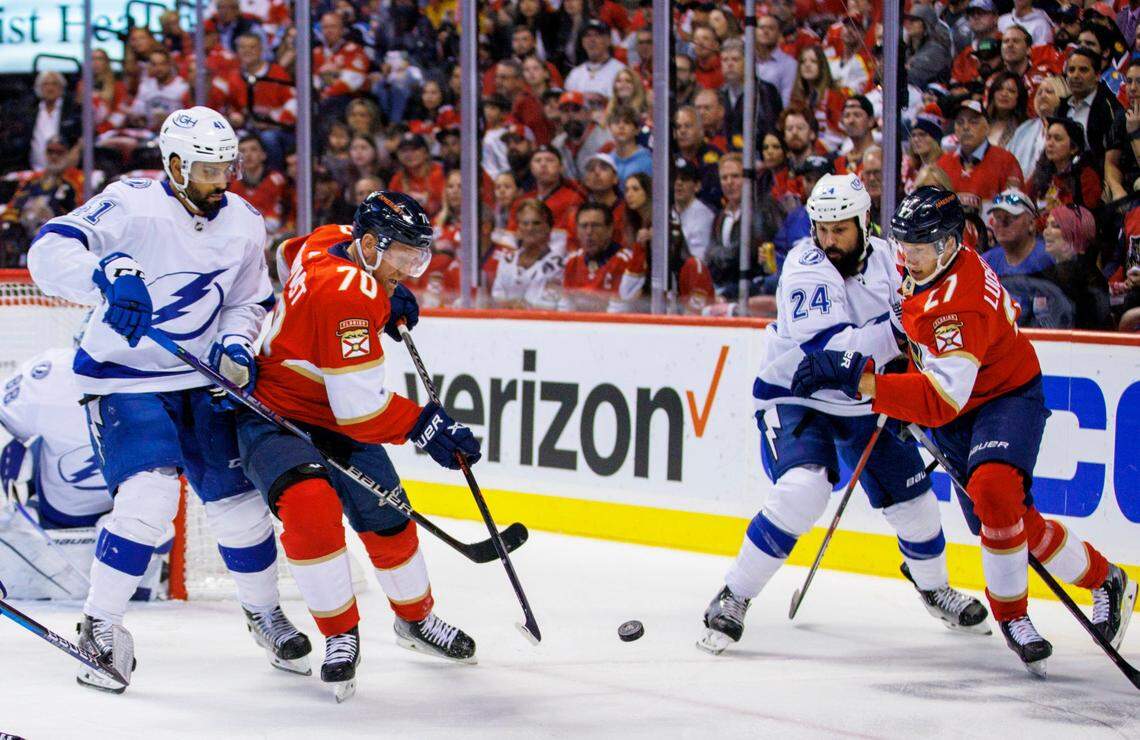 Florida Panthers right wing Patric Hornqvist (70) and center Eetu Luostarinen (27) battle for the puck against Tampa Bay Lightning left wing Pierre-Edouard Bellemare (41) and defenseman Zach Bogosian (24) during the first period of Game 2 of a second round NHL Stanley Cup series at FLA Live Arena on Thursday, May 19, 2022 in Sunrise, Fl.