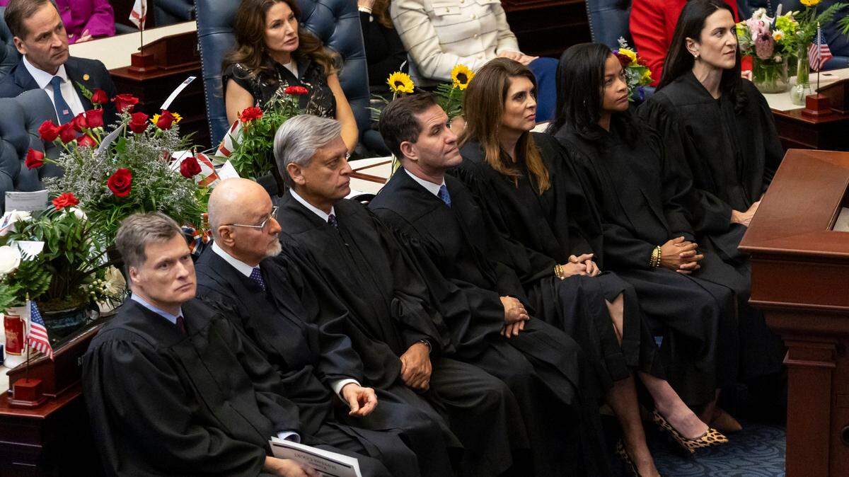 From left to right: Florida Supreme Court Justices Chief Justice Carlos G. Muñiz, Justice Charles T. Canady, Justice Jorge Labarga, Justice John D. Couriel, Justice Jamie R. Grosshans, Justice Renatha Francis and Justice Meredith L. Sasso listen to Florida Governor Ron DeSantis deliver his State of the State address during the first day of the legislative session at the Florida State Capitol on Tuesday, March 4, 2025, in Tallahassee, Fla.