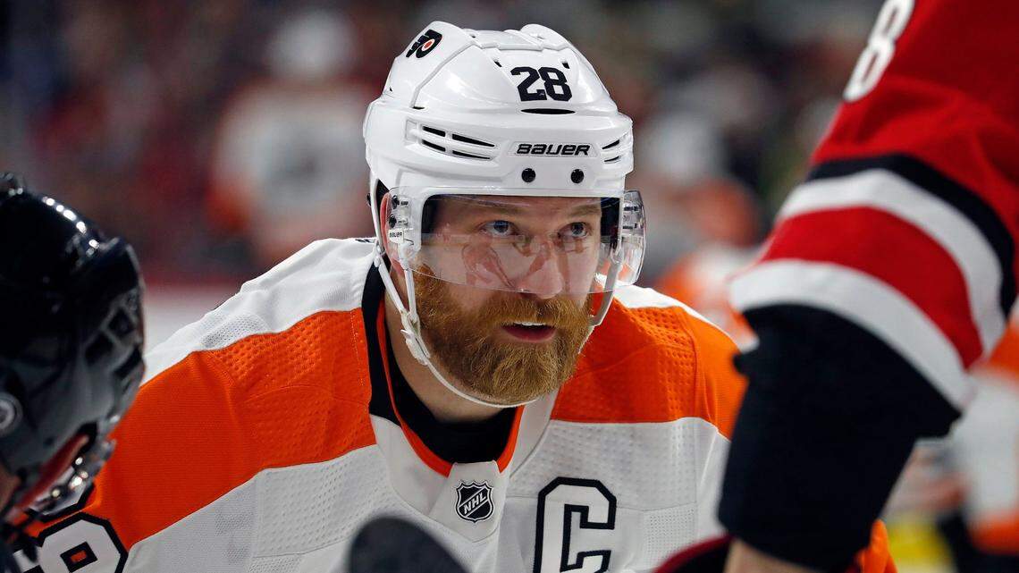 Philadelphia Flyers’ Claude Giroux (28) prepares for a face-off Carolina Hurricanes during the third period of an NHL hockey game in Raleigh, N.C., Saturday, March 12, 2022. (AP Photo/Karl B DeBlaker)