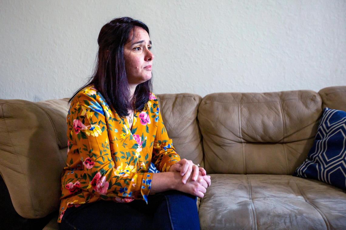 Arasay Penate, 37, looks toward the window in her home at their apartment in Miami, on Sunday, May 3, 2020. Penate has been forced to quit her supermarket job after the special needs daycare center for her 4-year-old son, who is on the autism spectrum, closed due to COVID-19.