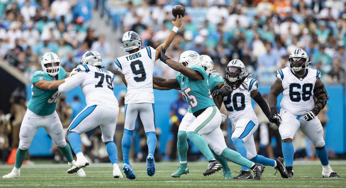 Miami Dolphins linebacker Tyrel Dodson (25) pressures Carolina Panthers quarterback Bryce Young (9) in the first half of their NFL game at the Bank of America Stadium on Sunday, Oct. 5, 2025, in Charlotte, N.C.