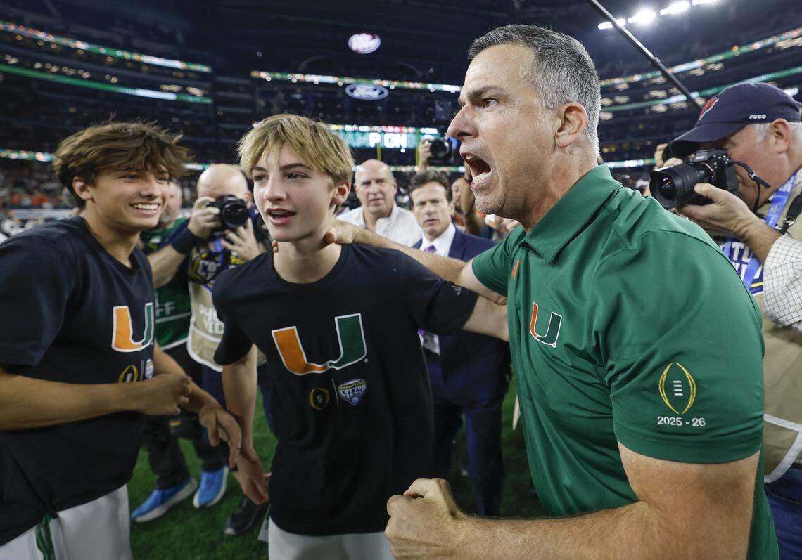 Miami Hurricanes head coach Mario Cristobal reacts as his sons, Mario Mateo Cristobal on the left, and Rocco Cristobal, at center, join in the celebration after the Canes defeat the Ohio State Buckeyes during the College Football Playoff quarterfinal game in the Cotton Bowl at AT&T Stadium in Arlington, Texas on Wednesday, December 31, 2025.