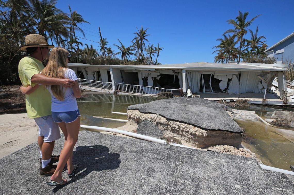 In September, Hurricane Irma made its first Florida landfall near Big Pine, causing this three-story Sandy Cove condo on Lower Matecumbe to collapse.  A day after the storm, Mike Gilbert and his daughter Brook Gilbert, 15, surveyed the ruins of his father's unit.