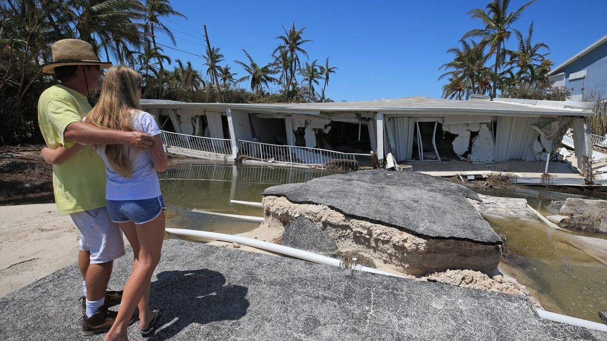 In September, Hurricane Irma made its first Florida landfall near Big Pine, causing this three-story Sandy Cove condo on Lower Matecumbe to collapse.  A day after the storm, Mike Gilbert and his daughter Brook Gilbert, 15, surveyed the ruins of his father's unit.