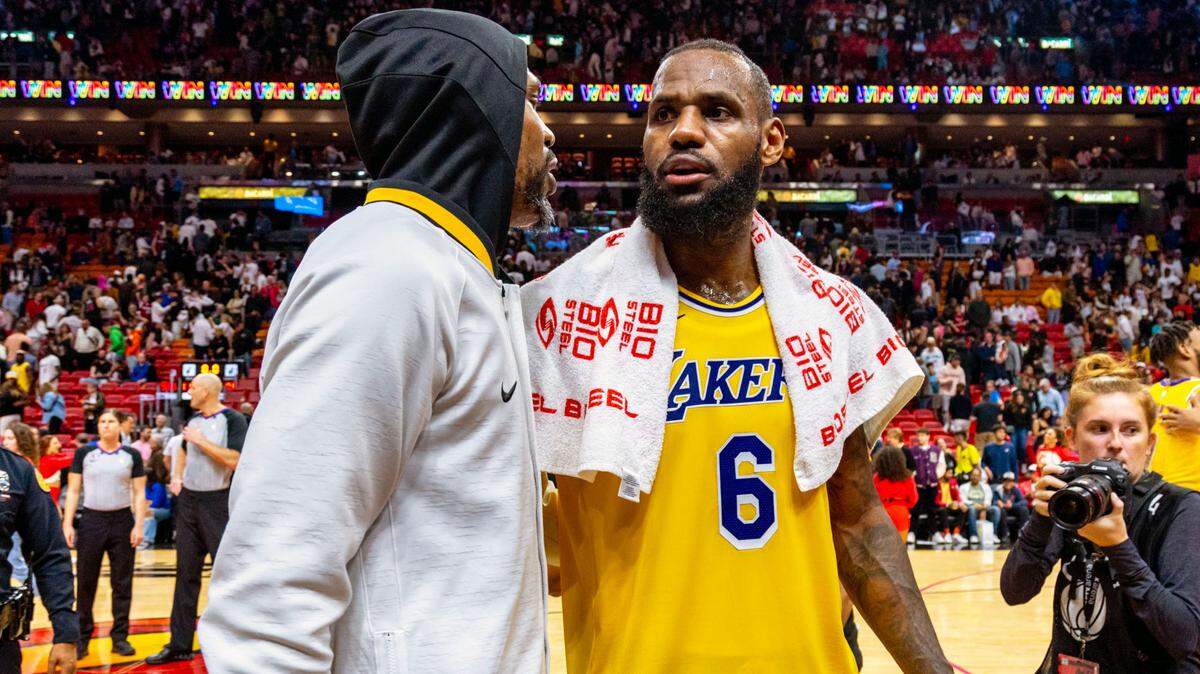 Miami Heat forward Udonis Haslem (40) speaks with Los Angeles Lakers forward LeBron James (6) after an NBA game at FTX Arena in Downtown Miami, Florida, on Wednesday, December 28, 2022.