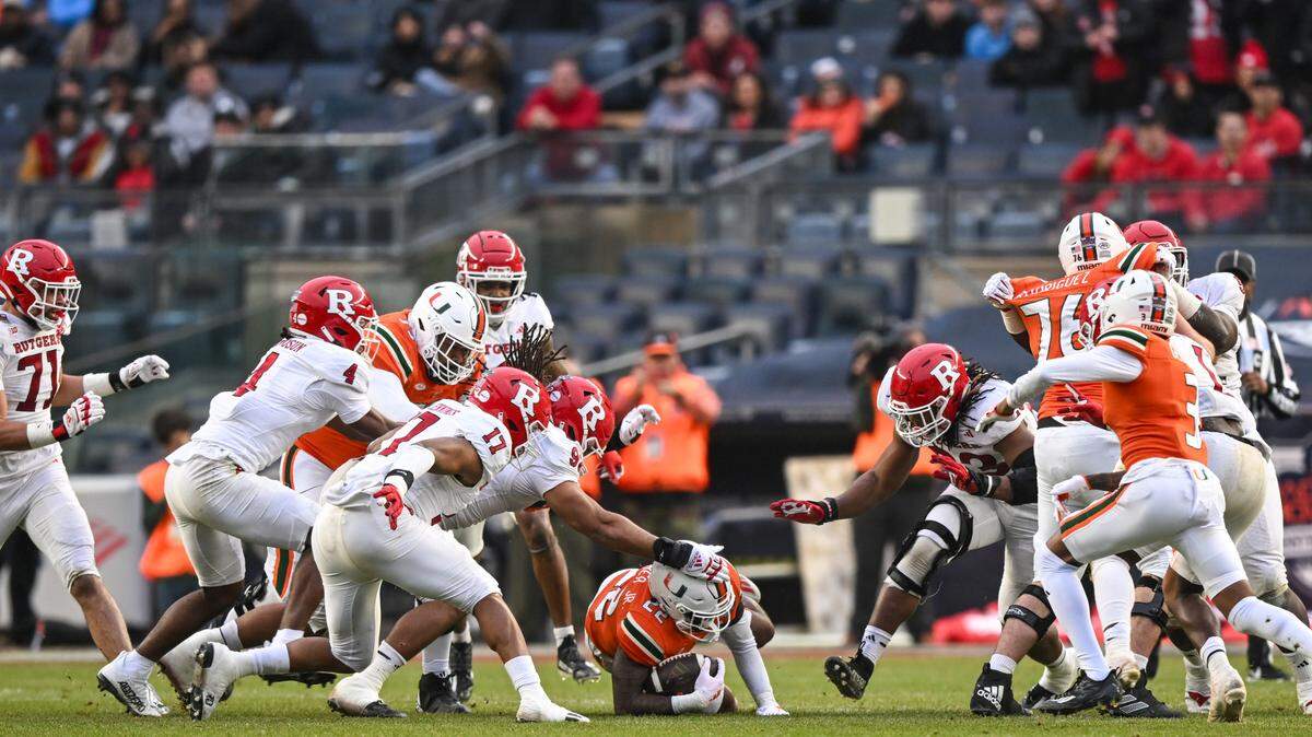 Dec 28, 2023; Bronx, NY, USA; Miami Hurricanes running back Mark Fletcher Jr. (22) dives for a first down during the first quarter against Rutgers Scarlet Knights at Yankee Stadium. Mandatory Credit: Mark Smith-USA TODAY Sports