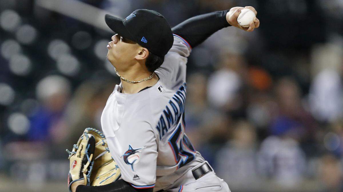 Miami Marlins starting pitcher Jordan Yamamoto winds up during the third inning of a baseball game against the New York Mets, Thursday, Sept. 26, 2019, in New York. (AP Photo/Kathy Willens)