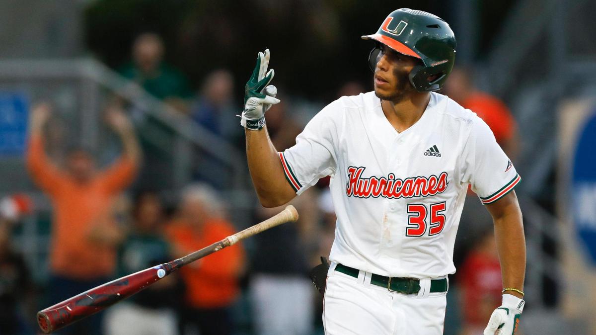 Miami Hurricanes infielder Yohandy Morales (35) reacts toward the dugout as he circles the bases after hitting his third home run of the game during the seventh inning of the Coral Gables NCAA baseball regional game against the Canisius Golden Griffins at Alex Rodriguez Park at Mark Light Field in Coral Gables, Florida, Saturday, June 4, 2022.
