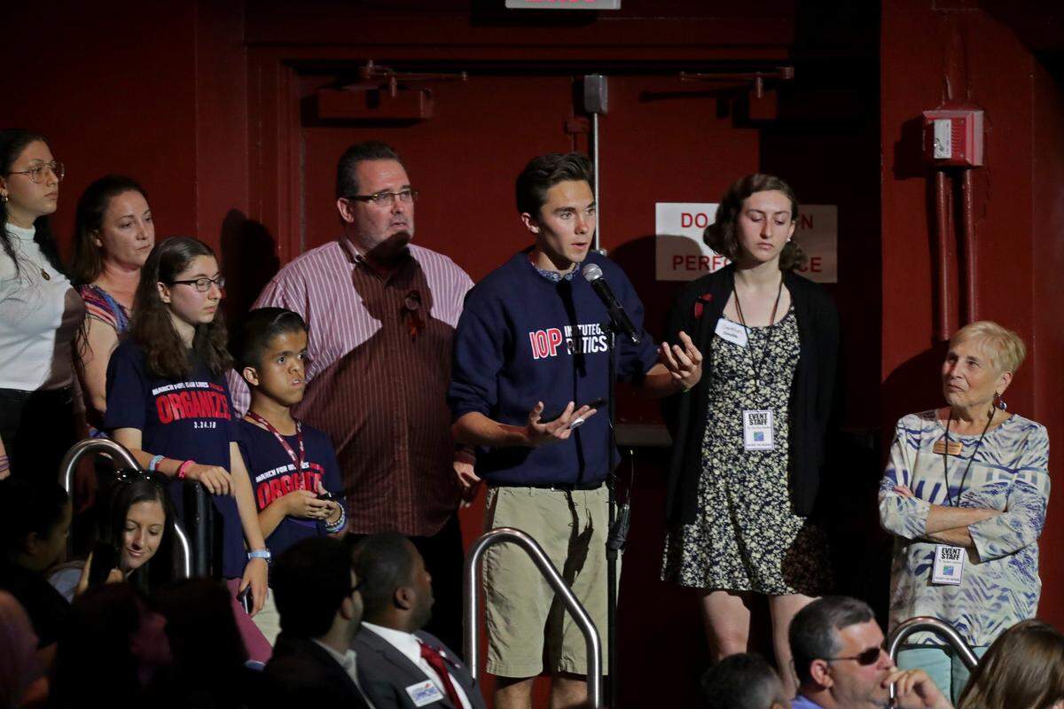 David Hogg, one of the leading voices among the Marjory Stoneman Douglas High students, asks U.S. Rep. Ted Deutch a question during a town hall meeting on gun violence in Coral Springs on Tuesday, April 3, 2018.