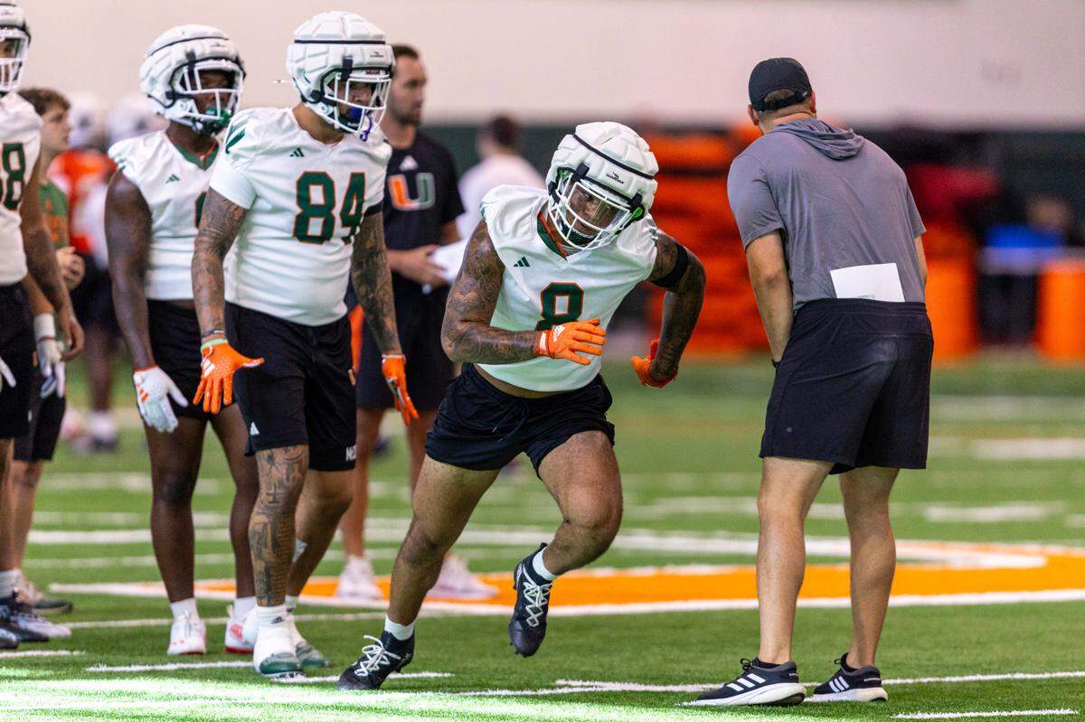 Miami Hurricanes linebacker Elijah Arroyo (8) runs through drills at the Carol Soffer Indoor Practice Facility on Thursday, August 1, 2024, in Coral Gables, Fla.