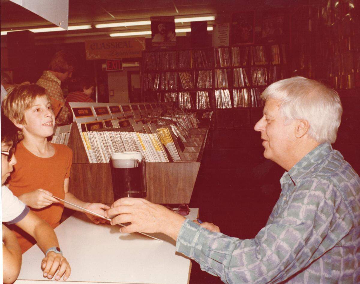 Renowned pianist Earl Wild at a signing event at record store. In the orange shirt is a young Abram Kreeger, oldest of Julian and Judy Kreeger’s three sons.