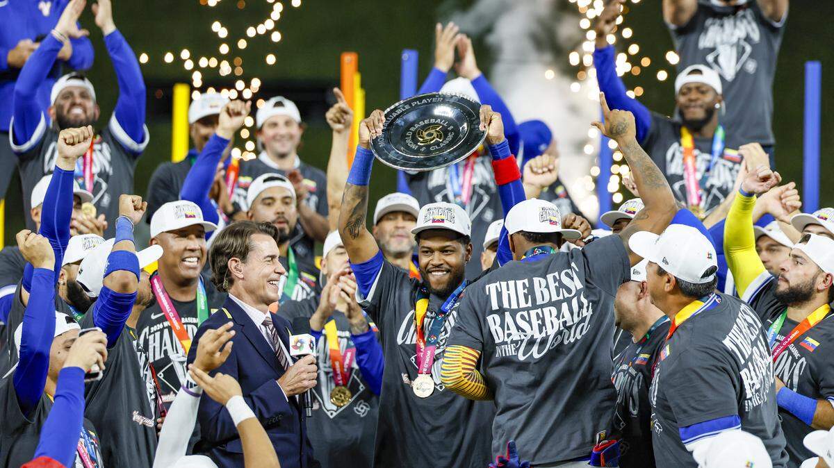 Venezuela third baseman Maikel Garcia (11) celebrates with teammates after Venezuela defeats United States in the final game of the 2026 World Baseball Classic at loanDepot park on Tuesday, March 17, 2026.