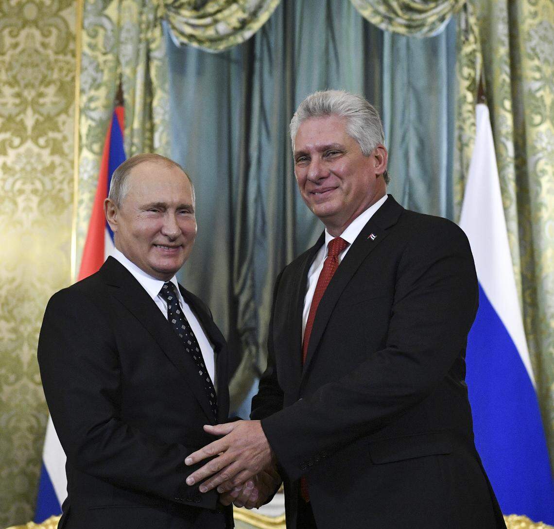 Russian President Vladimir Putin, left, and Cuban President Miguel Díaz-Canel greet each other during their meeting in the Kremlin in Moscow, Russia, Friday, Nov. 2, 2018.