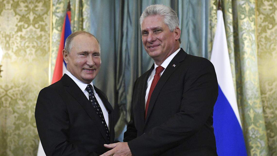Russian President Vladimir Putin, left, and Cuban President Miguel Díaz-Canel greet each other during a meeting in the Kremlin in Moscow on Nov. 2, 2018.