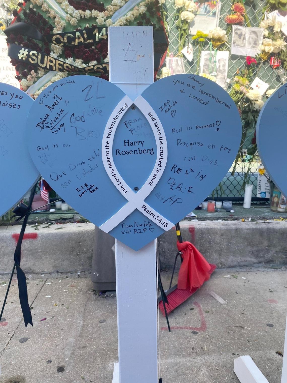 The marker of Harry Rosenberg, which stands before the memorial wall of the Surfside condo collapse victims, displays messages from people all over.
