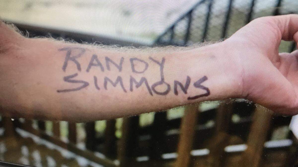 Randy Simmons, a property owner in Panama City Beach, wrote his name on his arm - just in case he needs to be IDed after Hurricane Michael.