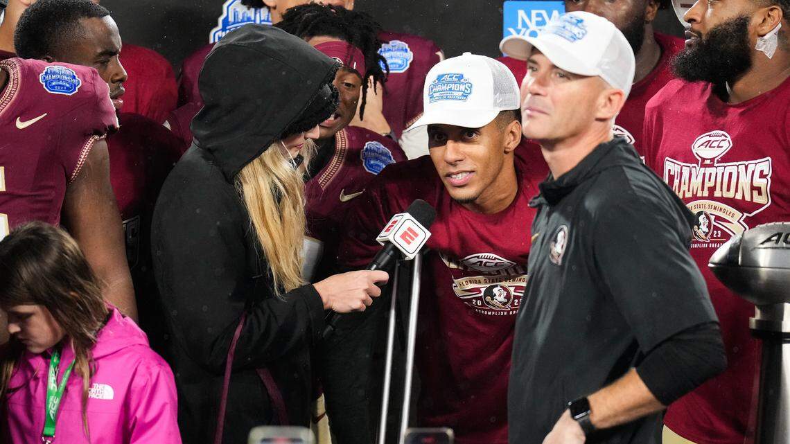 Dec 2, 2023; Charlotte, NC, USA; Florida State Seminoles quarterback Jordan Travis (13) does an interview after winning the ACC Championship game against the Louisville Cardinals at Bank of America Stadium.