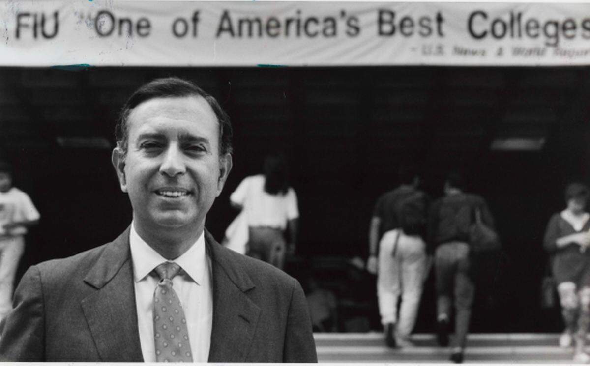 In 1991, FIU President Mitch Maidique stood in front of a sign proclaiming FIU ‘One of America’s Best Colleges according to U.S. News and World Report.’