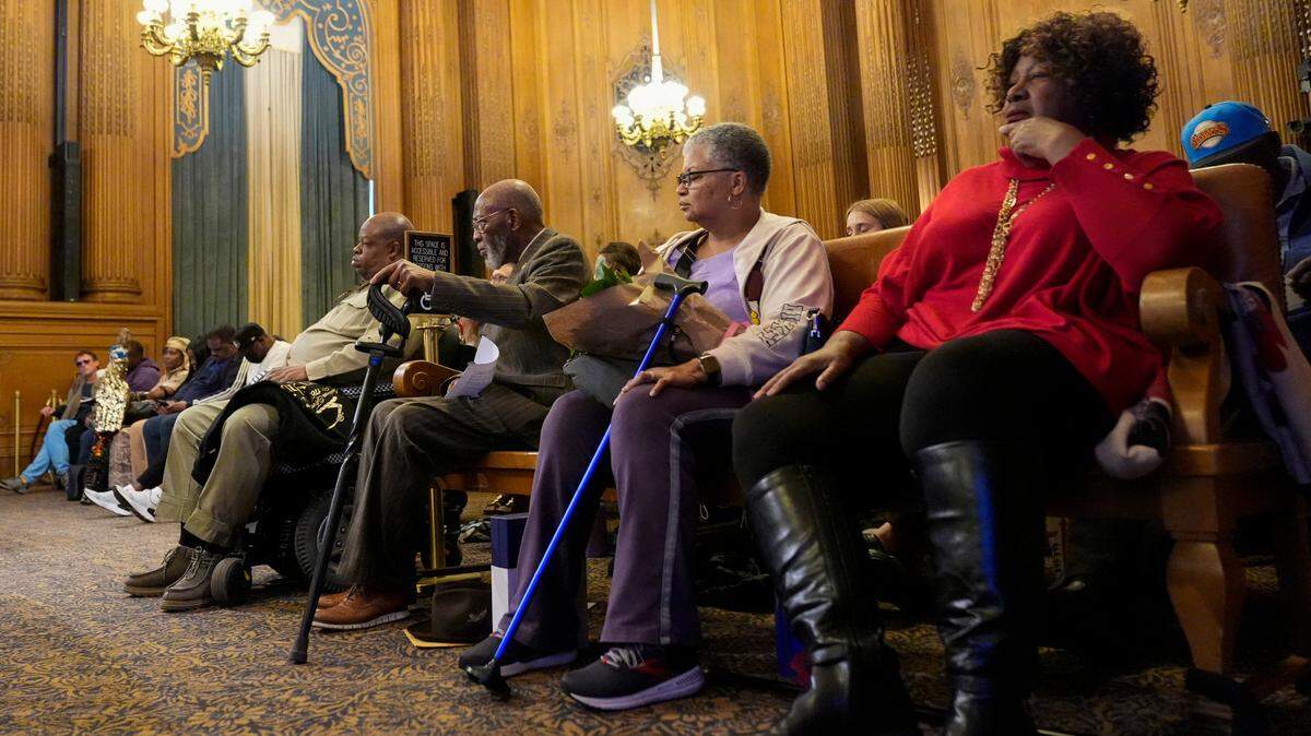 San Francisco NAACP President Amos Brown, third from right, listens at a San Francisco Board of Supervisors meeting at City Hall, Tuesday, Feb. 27, 2024, in San Francisco. Supervisors in San Francisco formally apologized Tuesday to African Americans and their descendants for the city’s role in perpetuating racism and discrimination. (AP Photo/Godofredo A. Vásquez)