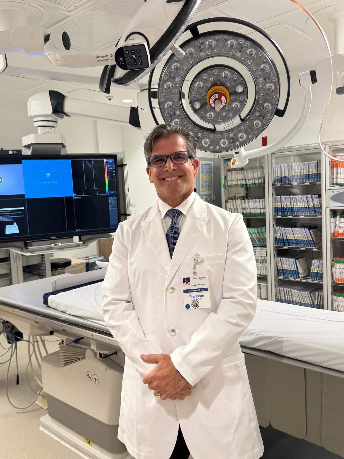 Dr. Juan Zambrano, director of cardiovascular medicine at Jackson South Medical Center, gives a tour of the newly renovated catheterization lab at Jackson South on Tuesday, July 22, 2025.