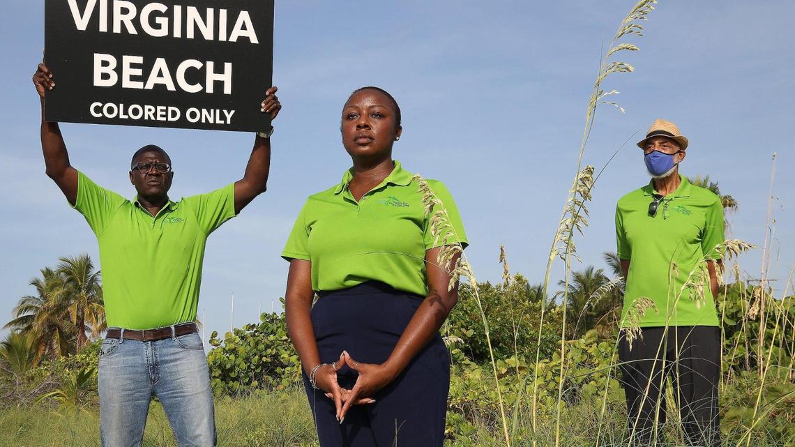 From left, Guy Forchion, executive director, Kechi Okpala, marketing consultant, and Gene Tinnie, president of the Virginia Key Beach Park Trust, are photographed on the beach that was once only for people of color. The Virginia Key Beach Park, founded in 1945, celebrated its 75th anniversary and received a historic day recognition on Aug. 1, 2020.