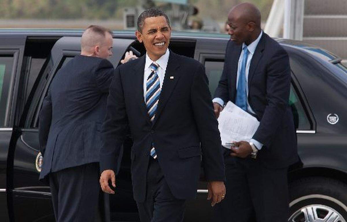 In this file photo from Oct. 26, 2009, President Barack Obama walks with Navy personnel before boarding Air Force One in Jacksonville, Florida.