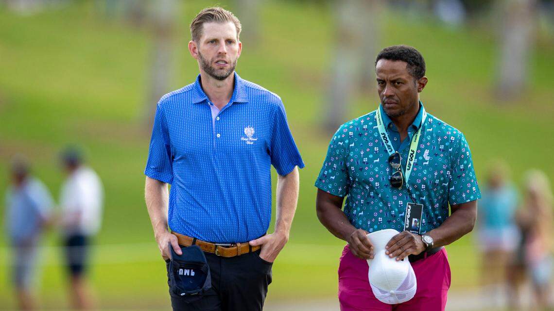 Eric Trump, left and Saudi Golf CEO Majed Al Surour, right, speak as they walk down the fairway of the second hole during the second round at the LIV Golf Invitational Miami at Trump National Doral Golf Club on Saturday, October 28, 2022 in Doral, Fla. Trump, the son of the president-elect, is raising concerns about Miami-Dade County buliding an incinerator in Doral, where the family owns a golf resort.