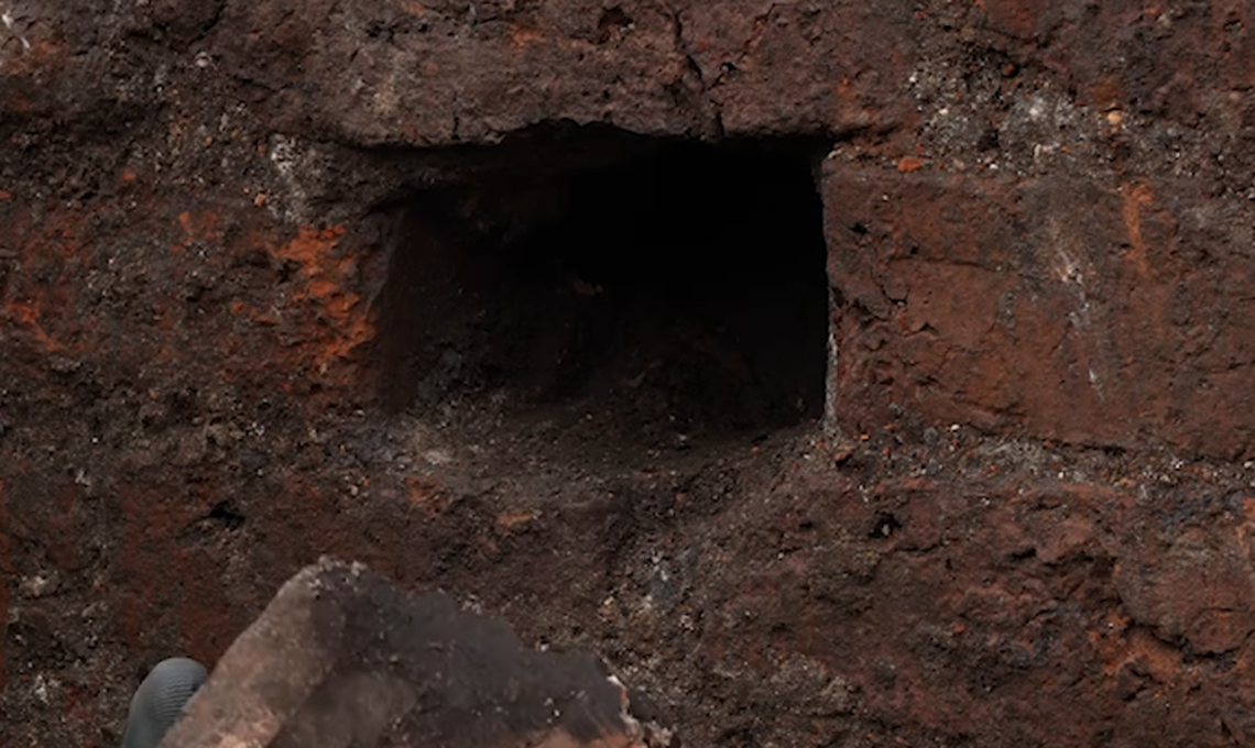 One brick in the cellar was cut out, and a small hole was present in the back where something could be hidden, archaeologists said.