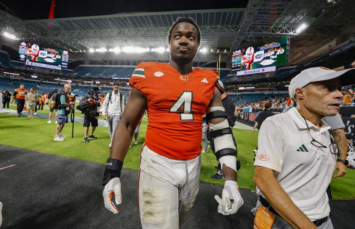 Miami Hurricanes defensive lineman Rueben Bain Jr. (4) come off the field after the Canes defeat the South Florida Bulls during their NCAA football game at Hard Rock Stadium in Miami Gardens, Florida, on Saturday, September 13, 2025.
