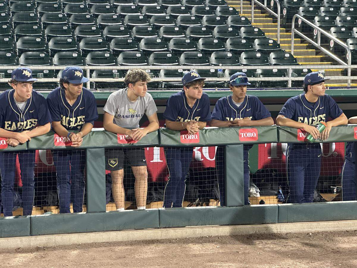 A dejected group of North Broward Prep baseball players look on after the Eagles lost 6-5 to Santa Rosa Beach South Walton in the Class 3A state championship game at Hammond Stadium in Fort Myers, Fla.