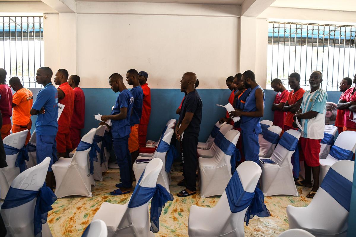 Prisoners attend a prayer ceremony inside Haiti’s National Penitentiary in Port-au-Prince on Aug. 30, 2019. The political crisis that has paralyzed Haiti since late August has had extreme consequences for prisoners, the vast majority of whom have been waiting to be tried for months or even years.