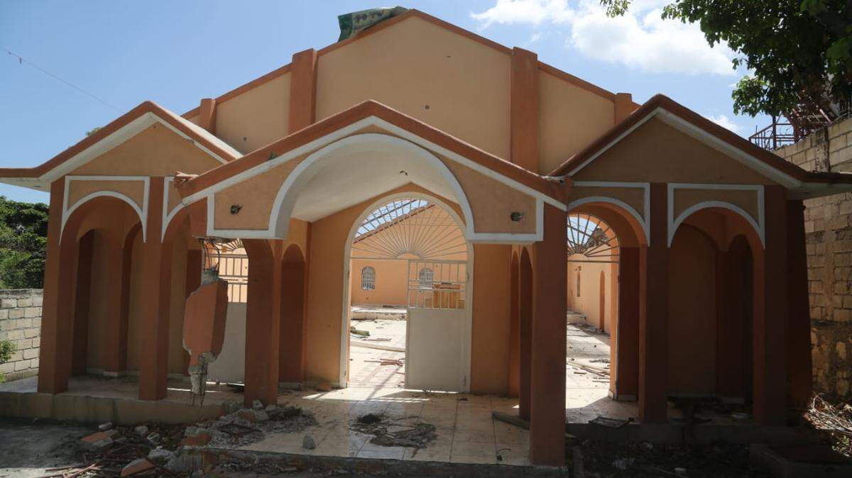 This church with its missing rooftop is one of many buildings and private homes that have been destroyed in the center of Port-au-Prince by members of the Viv Ansanm gang coalition. 