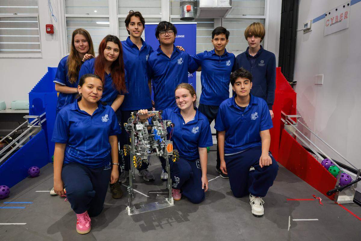 Members of the Cyber Spartans robotics team at Miami Country Day School pose with the robot the team will enter in the Florida state championship during a presentation at the Garner Center for Innovation at 601 NE 107th St., on Monday, March 2, 2026, in Miami. Fla.