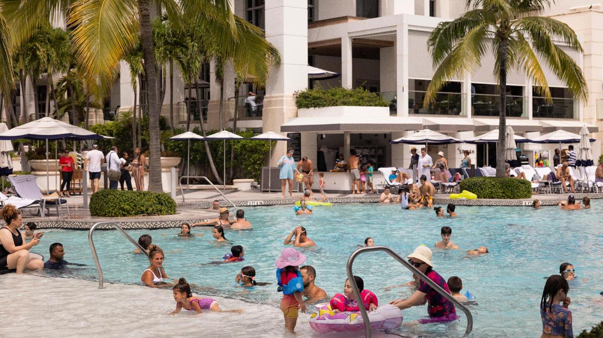 Families staying at the hotel spend time at the pool on Thursday, Aug. 17, 2023, at Loews Miami Beach Hotel.