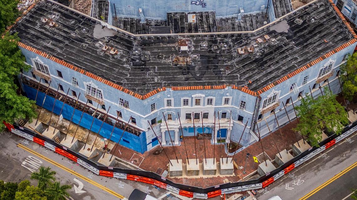Aerial view of the historic Coconut Grove Playhouse after external support beams were installed to stabilize the historic theater’s front. A contractor’s error during interior demolition work caused a partial floor collapse that left the structure at risk of collapse.