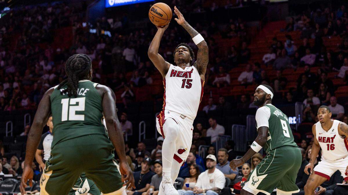 Miami Heat forward Myron Gardner (15) shoots the ball during the first half of an NBA preseason game against the Milwaukee Bucks at Kaseya Center on October 6, 2025, in Miami.