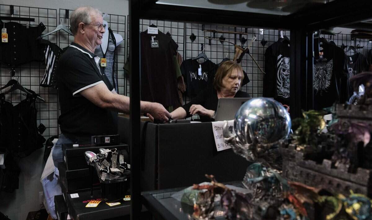 James Jones, left, owner and operator, works with his wife, Ana, to ring up customers shopping the closing sale at their store, Freak House, an alternative clothing store, on Thursday, June 18, 2026, on S Dixie Hwy in Miami, Fla. Freak House, owned and operated by James and Ana Jones, is closing its doors next Friday.