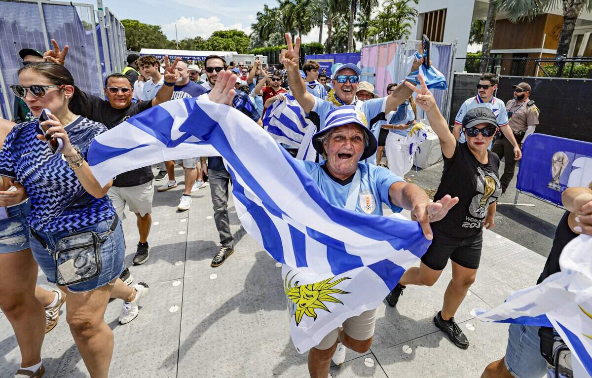 Soccer fans rush through the gates in advance of the Uruguay against Saudi Arabia FIFA World Cup opening match at Miami Stadium on Monday, June 15, 2026.