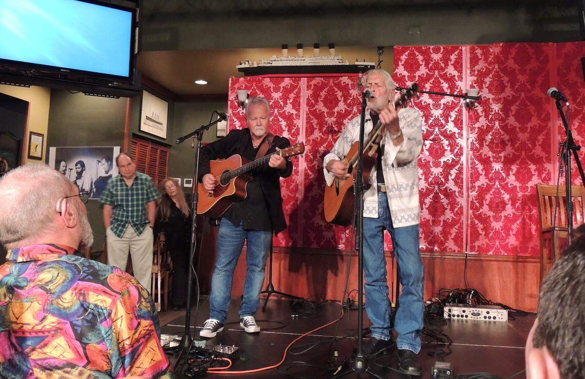 Folk singer Bobby Ingram, right, performs with longtime musical partner Kevin Hurley at the former Flick coffeehouse in Coral Gables in 2014.
