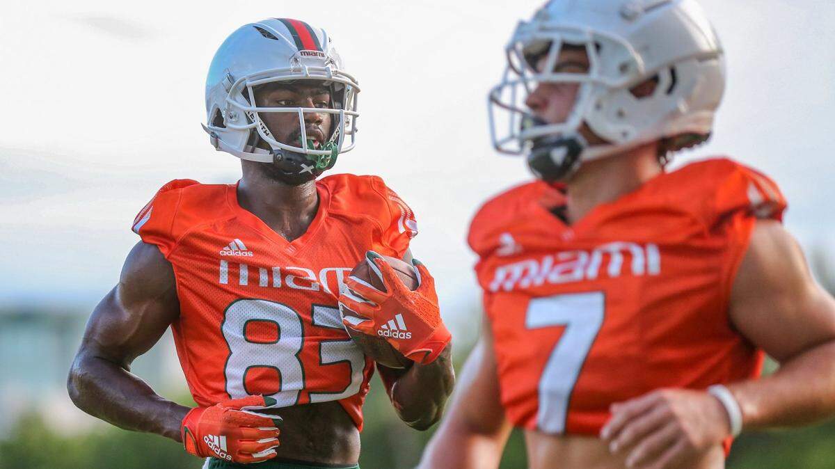 Miami Hurricanes wide receiver Michael Redding III, left, and wide receiver Xavier Restrepo run drills during practice at the University of Miami’s Greentree Practice Field in Coral Gables on Saturday, Aug. 7, 2021.